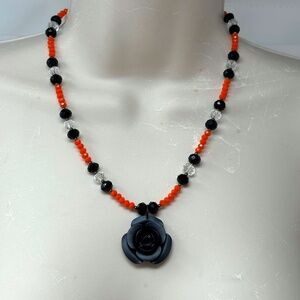 Handmade Beaded Necklace Orange and Black Glass Beads with Black Flower Pendant